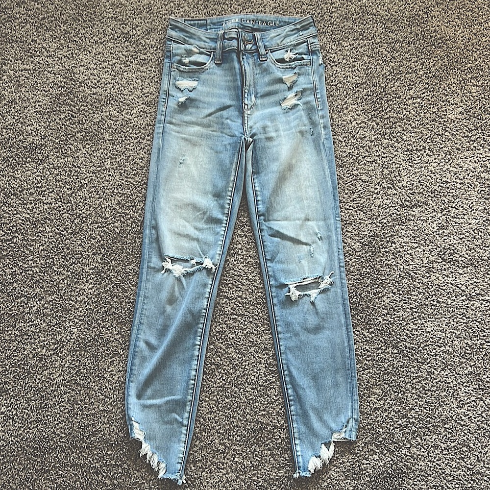American Eagle Distressed Jeans. Next level stretch light wash, size 00 regular